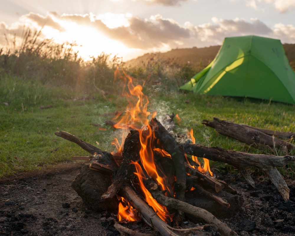 green-tent-and-campfire-at-sunset